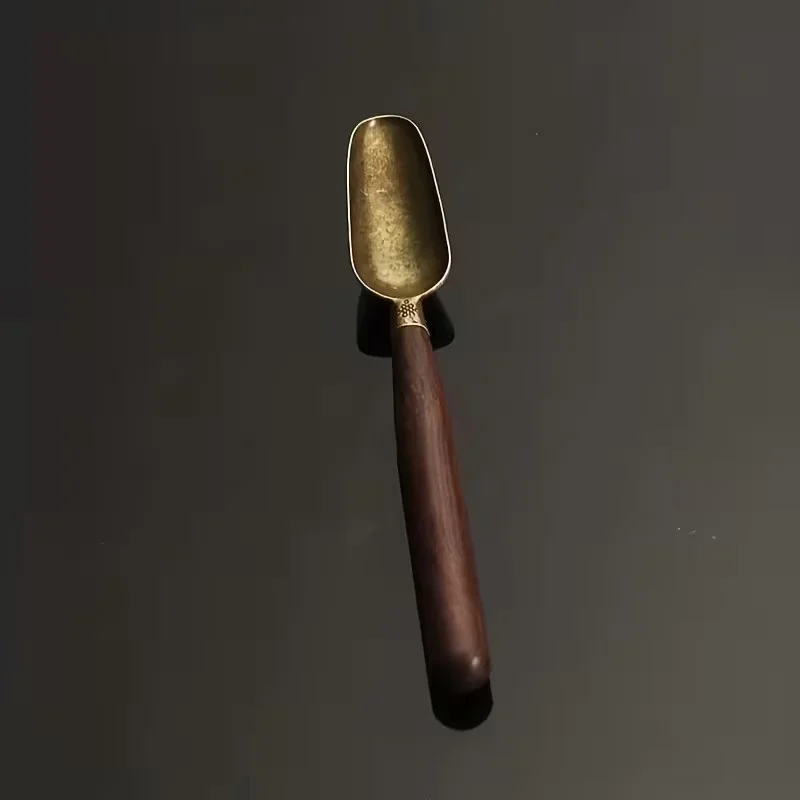 Metāla karote ar sandalkoka rokturi tējai un kafijai